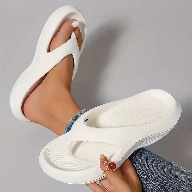 Women's black thick-soled EVA flip-flops with non-slip tread in a paired size format