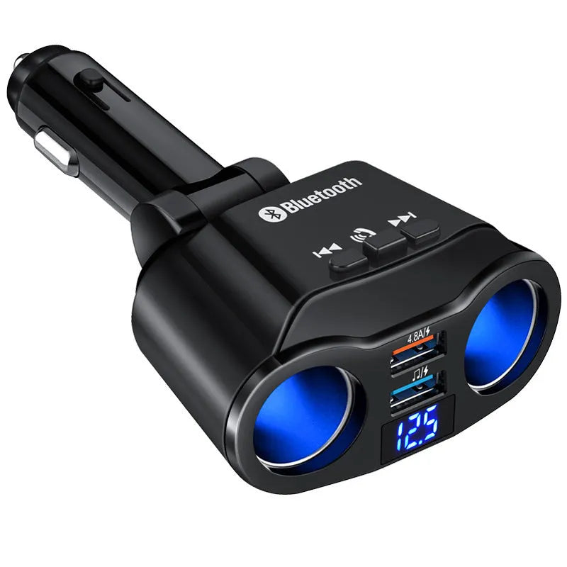 A black car Bluetooth FM transmitter with a USB port plugged into a vehicle's cigarette lighter socket.