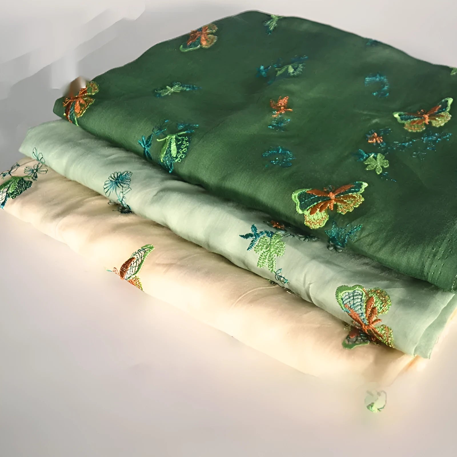 Pure ramie hanfu fabric showing texture detail with beige, grass green and dark green colour swatches
