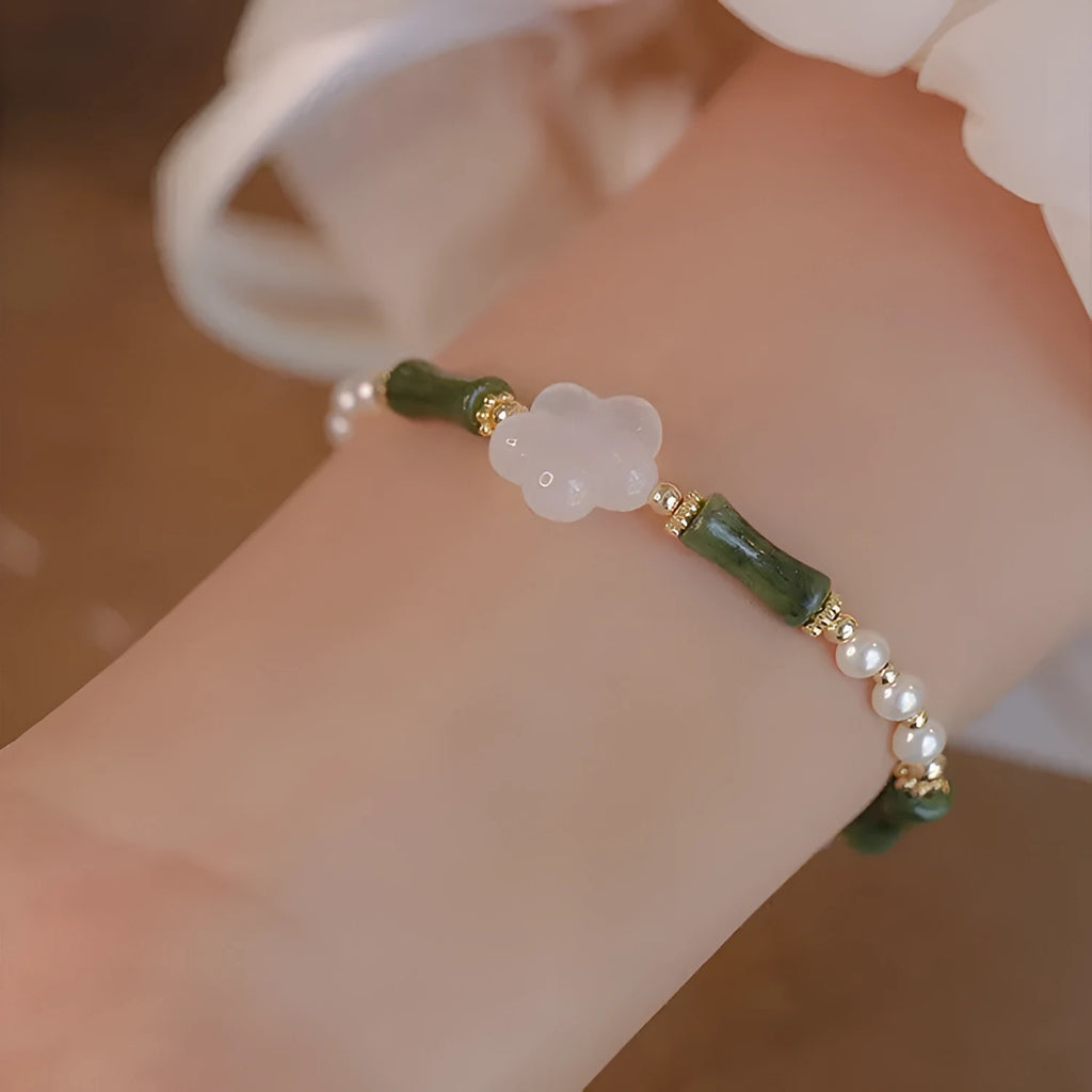 Chinese style women's bracelet with Hetian jade, bamboo joint design, and 4mm shell pearl components