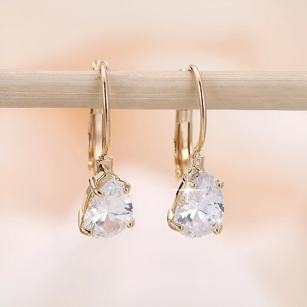 Women's drop-shaped metal earrings with platinum gemstone decoration in gold and platinum colour options