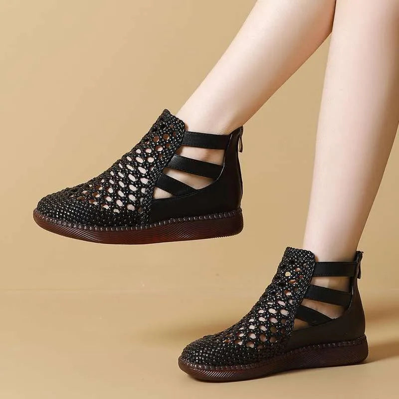 Women's flat gold sandals with hollow-out design and soft sole.