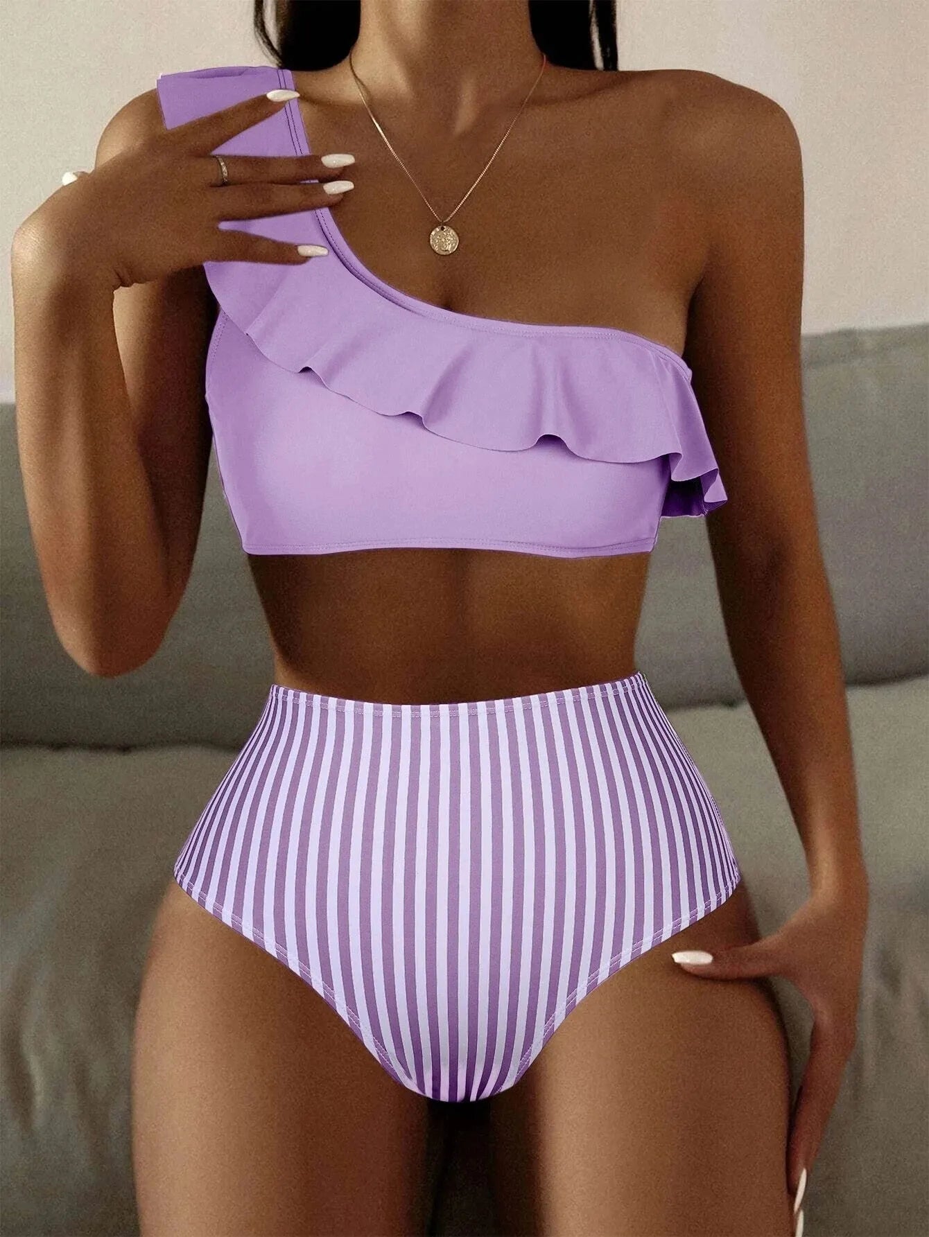 Women's striped solid colour split bikini swimsuit in polyester spandex blend showing multiple colour options