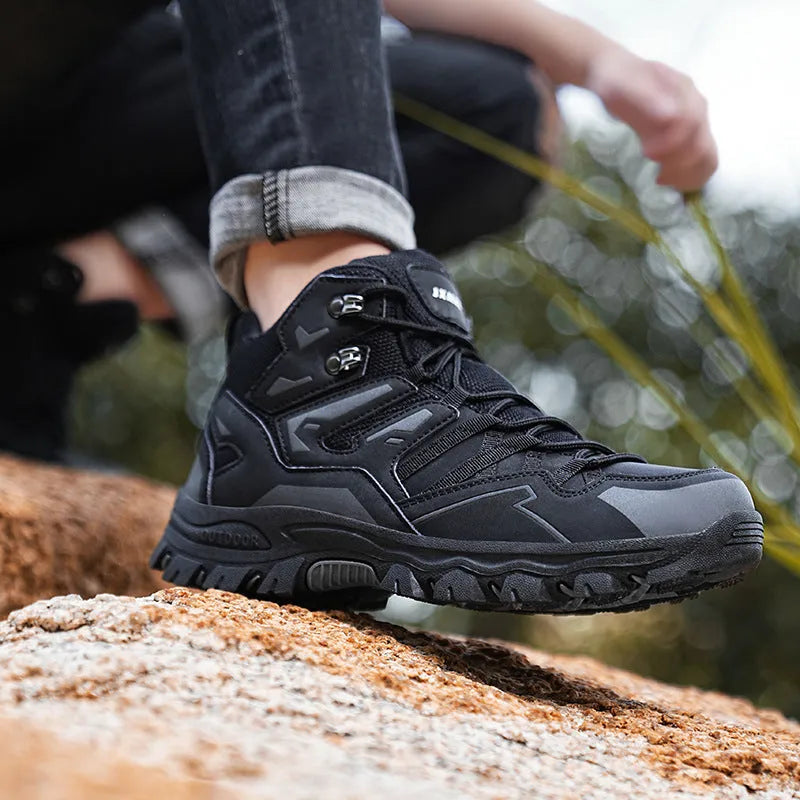 Low-top hiking sneakers in multiple colours on a rocky outdoor trail.
