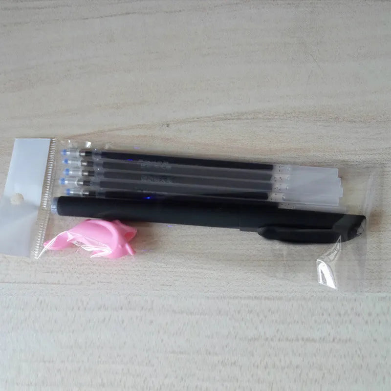 Automatic fade and disappear pen set showing pen holder, case, and eight refills