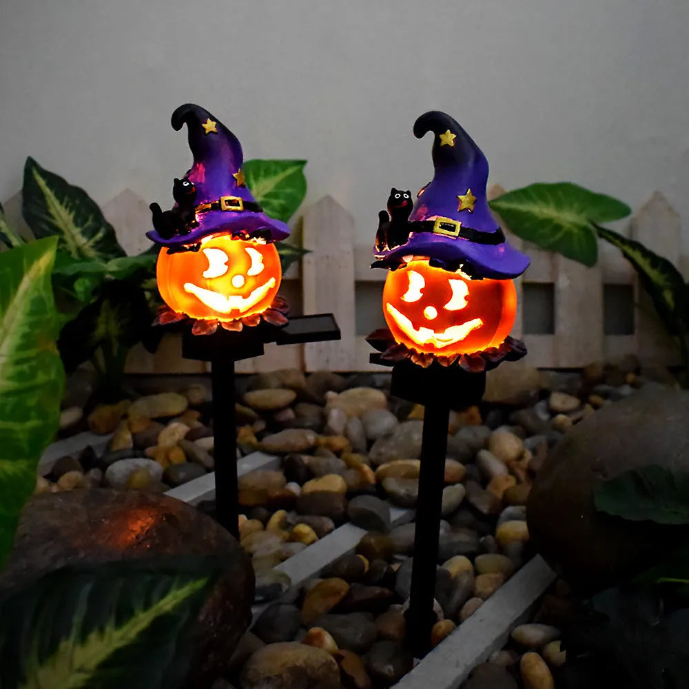 Solar Halloween pumpkin lantern on ground stake, wrought iron outdoor path light with 40x40mm solar panel, IP55 waterproof.