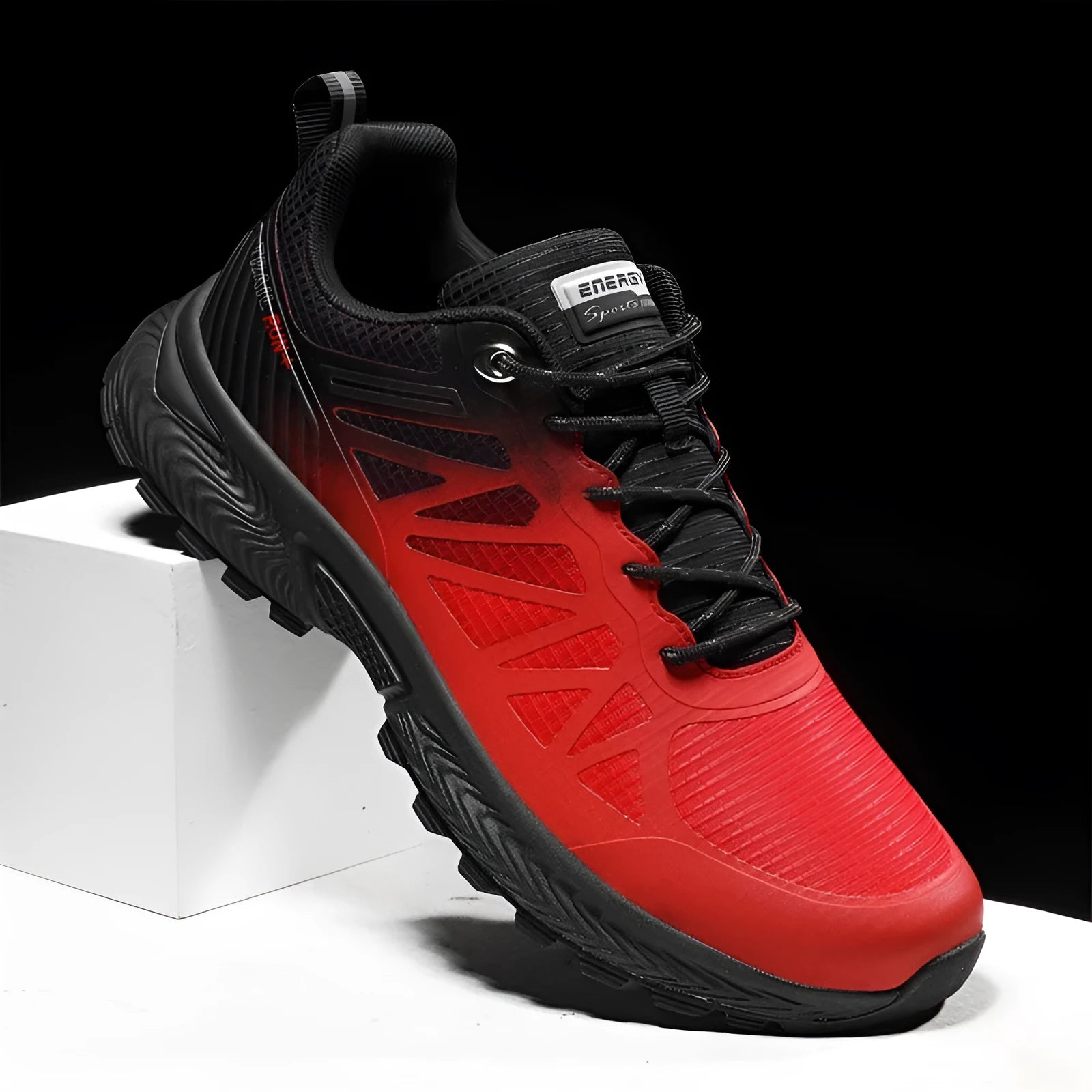 Men's black and orange breathable mesh running shoes with rubber sole on a white background.