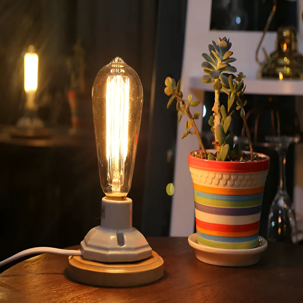 Retro American country style ceramic table lamp with a wooden base and glass shade on a wooden table.