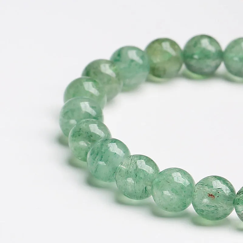 Natural green strawberry quartz bracelet with 7.5mm beads in geometric pattern
