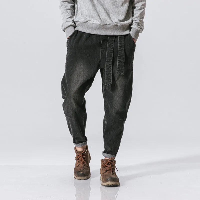 Punk stretch bike denim jeans in solid colour with elastic waist and patches