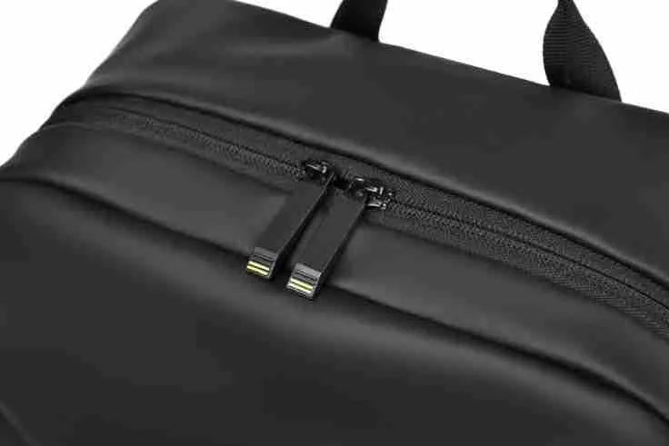 Large waterproof PU leather backpack for men in black, shown with computer compartment