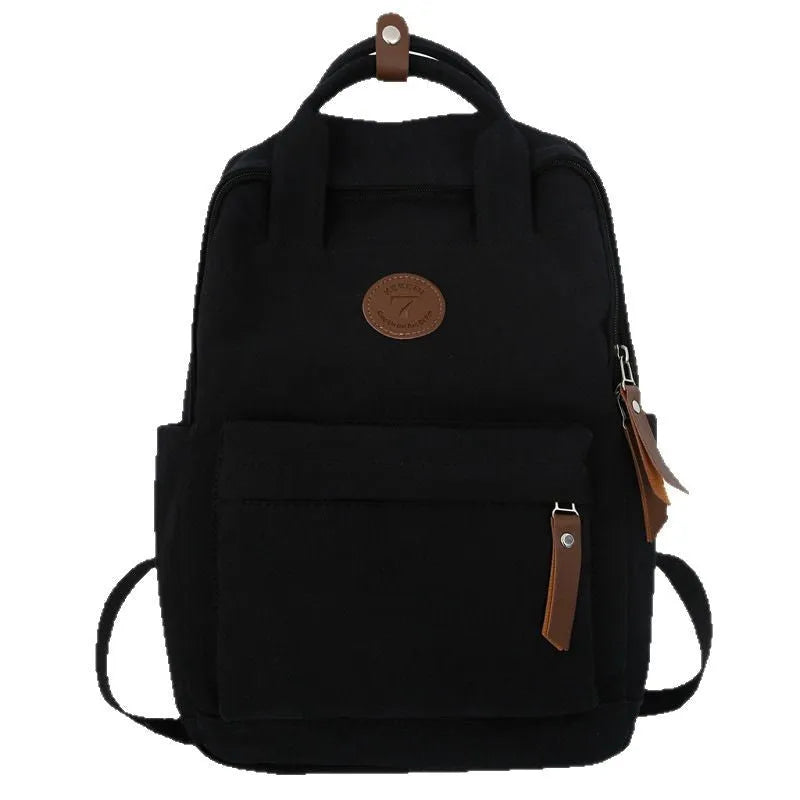 Black retro-style Oxford cloth backpack with curved shoulder straps and sewing thread detail.