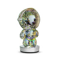 3D stereo astronaut atmosphere light with glass shade and USB charging on a desk