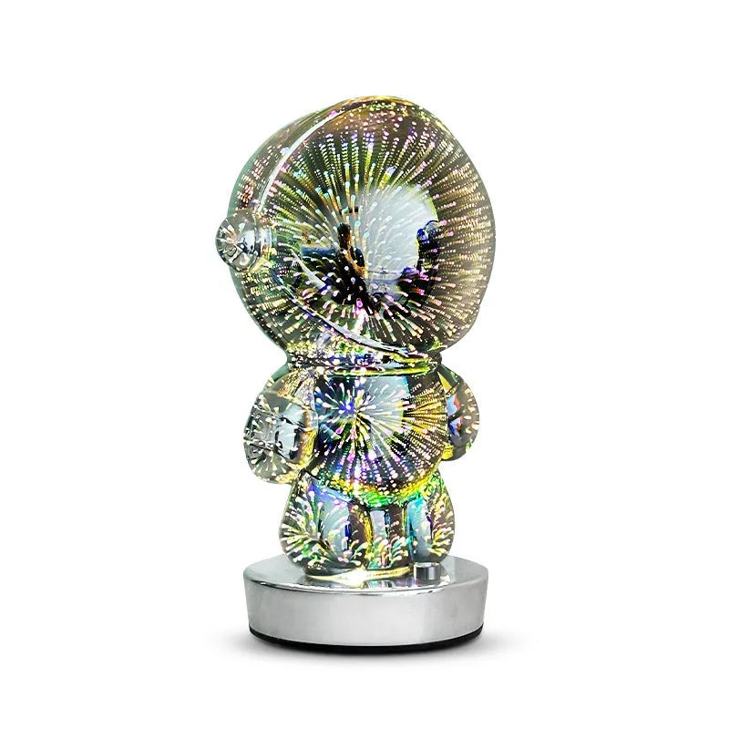 3D stereo astronaut atmosphere light with glass shade and USB charging on a desk