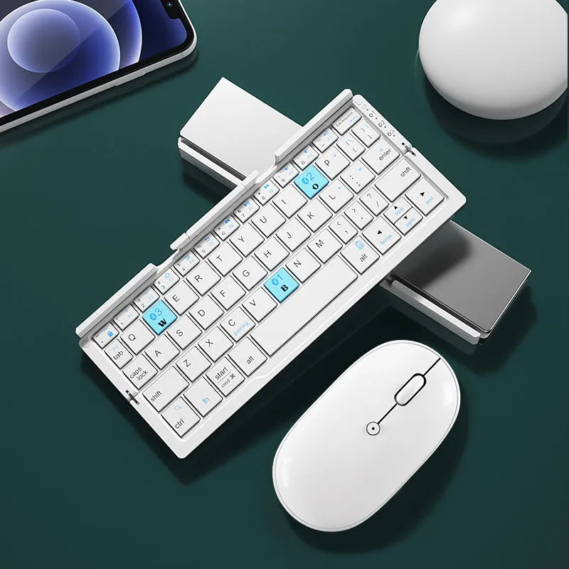 Silver aluminium foldable Bluetooth keyboard with stand holding smartphone