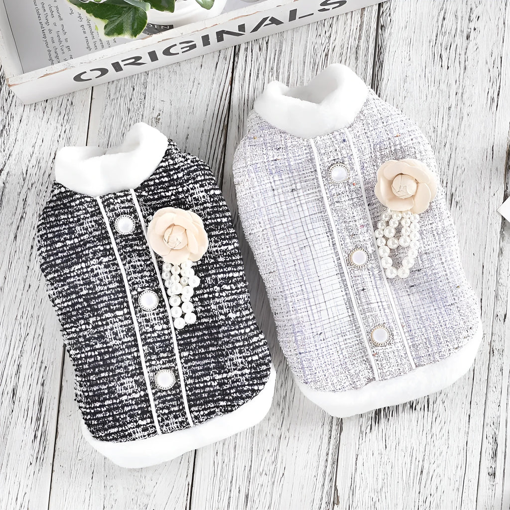 Black PU sausage jacket for cats shown on small feline model