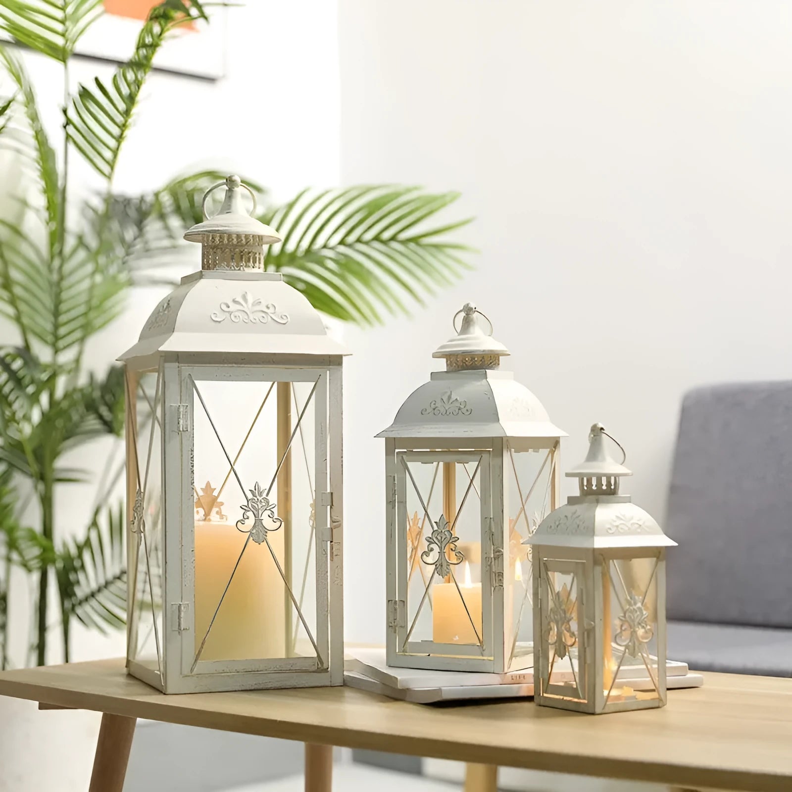 Wrought iron floor-standing storm lantern with tempered glass panels in black gold brushed finish.