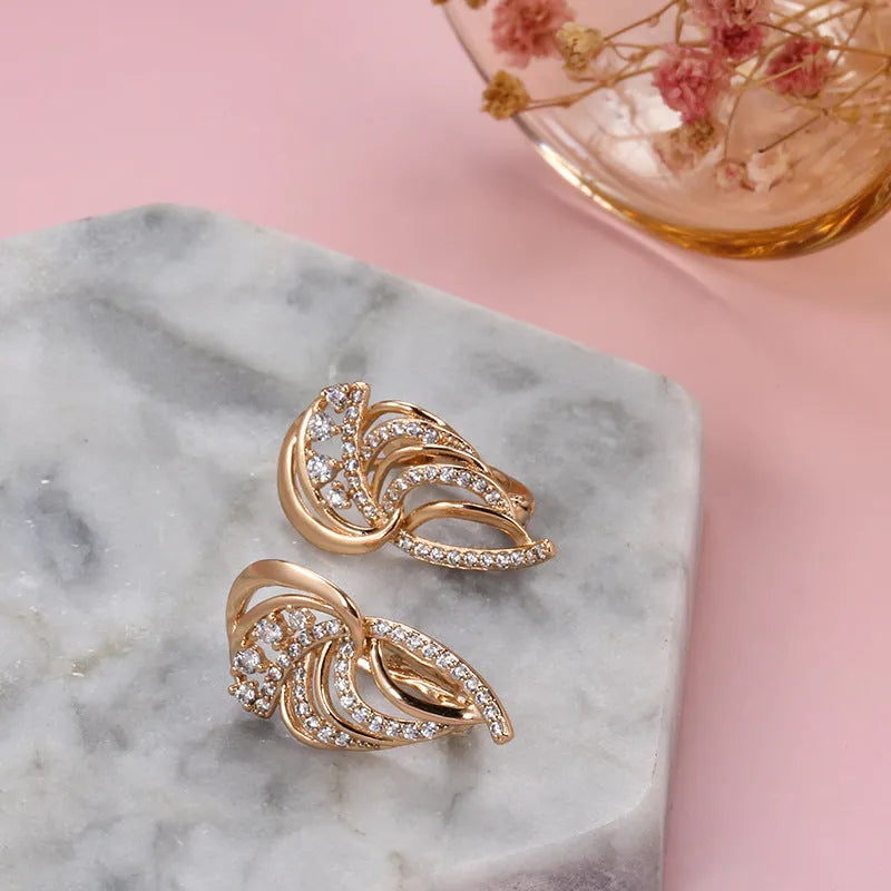 Women's gold-plated copper clip earrings with geometric wings design and zircon inlay in H0195 colour