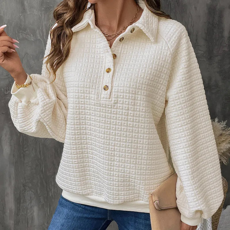 Women's milky white polo collar pullover sweater with long sleeves on a hanger.