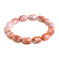 Natural cherry agate barrel bead bracelet with Ruyi charm showing 10x14mm beads
