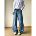 Retro blue plaid wide-leg skinny jeans showing straight-leg cut and zip fly