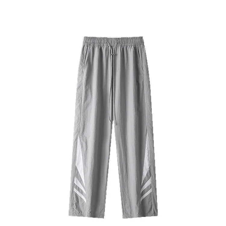 Men's straight leg casual trousers in black, featuring a mid waist with elastic and a cardigan button fly.
