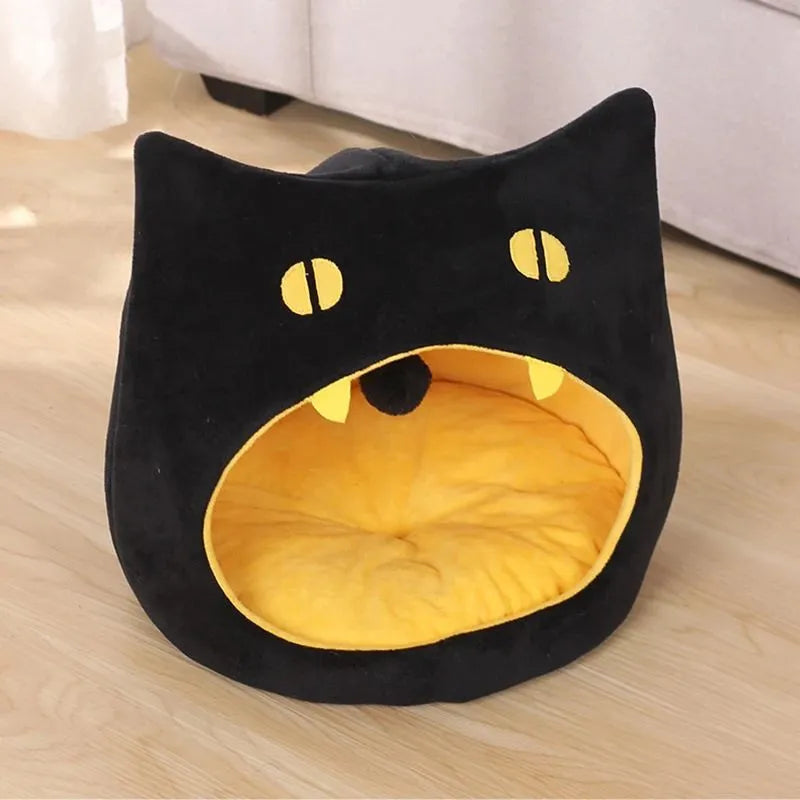 Soft plush covered cat cave bed with anti-slip bottom for cats and small dogs.