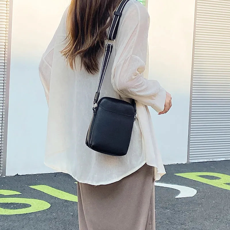 Solid colour PU leather mobile phone crossbody bag measuring 14.5x5.5x19cm