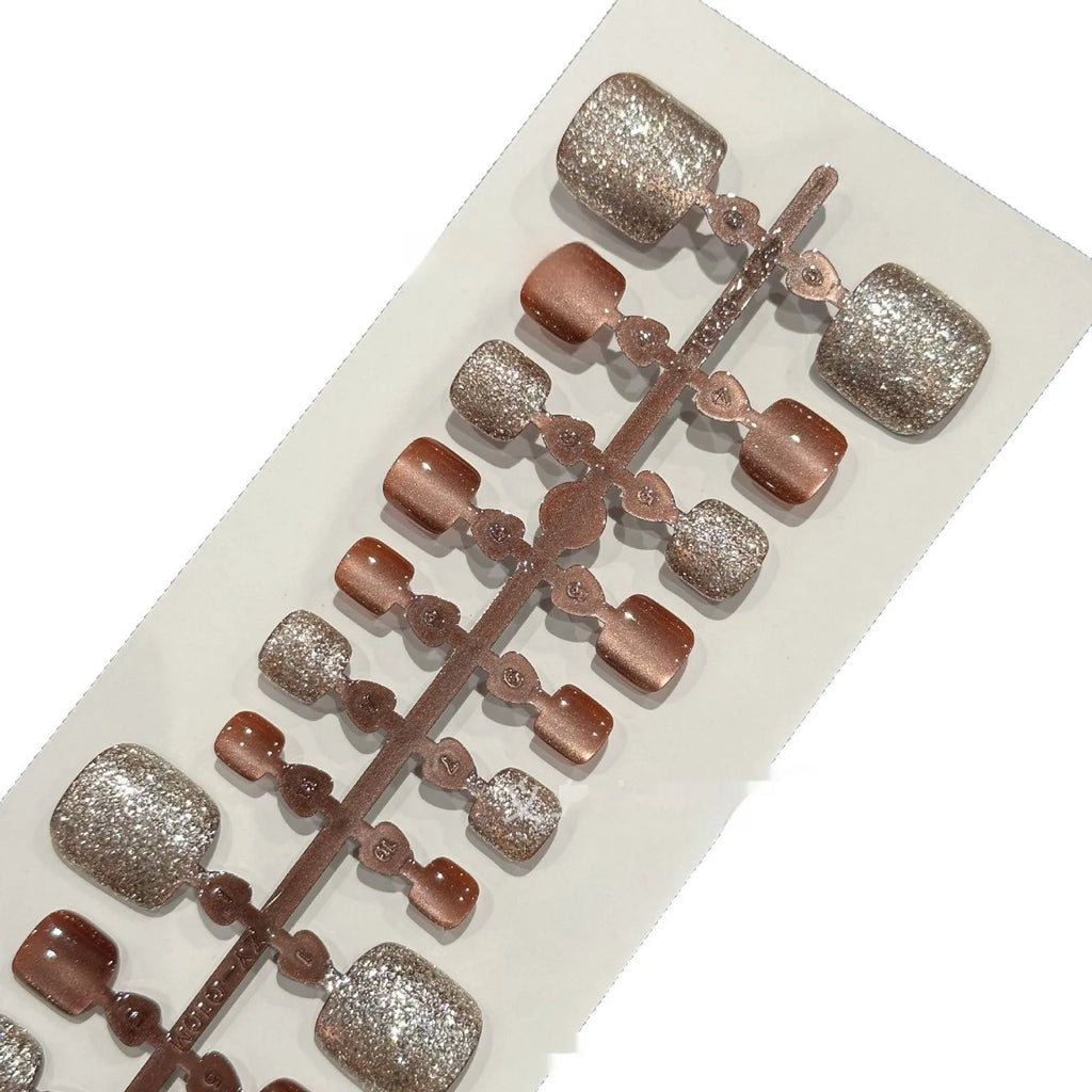 Brown crystal cat eye rhinestone toenail wear patch set with 42 pieces in three sizes on a white background