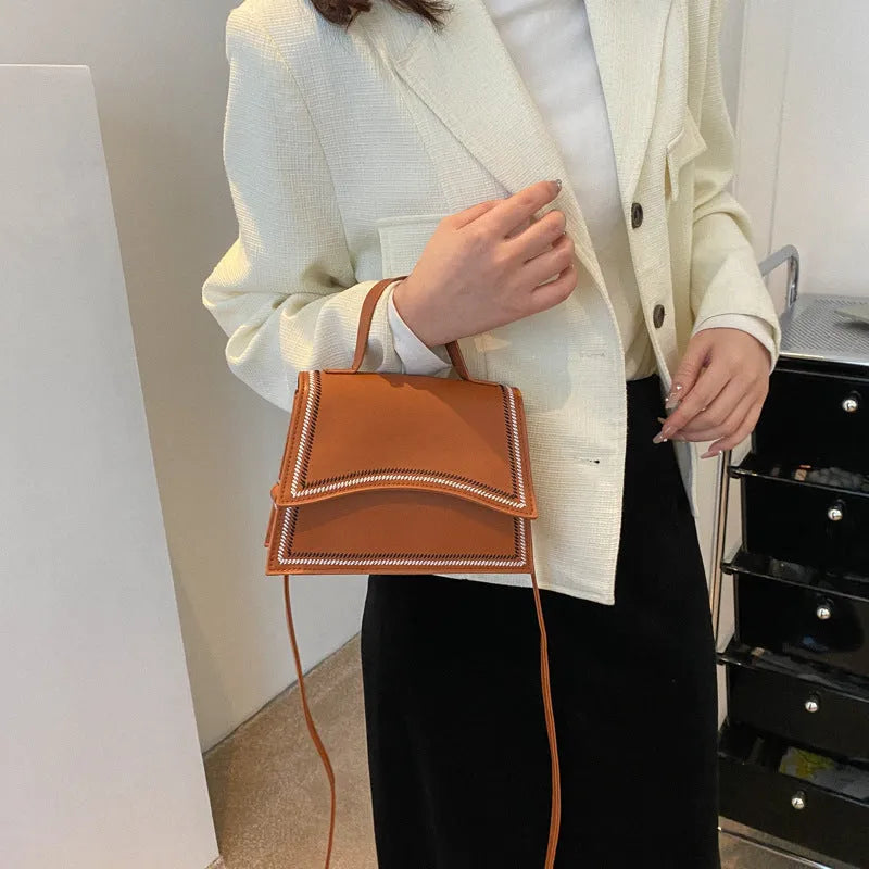 Urban simple PU crossbody flap bag with sewing line detail available in black, brown, and white