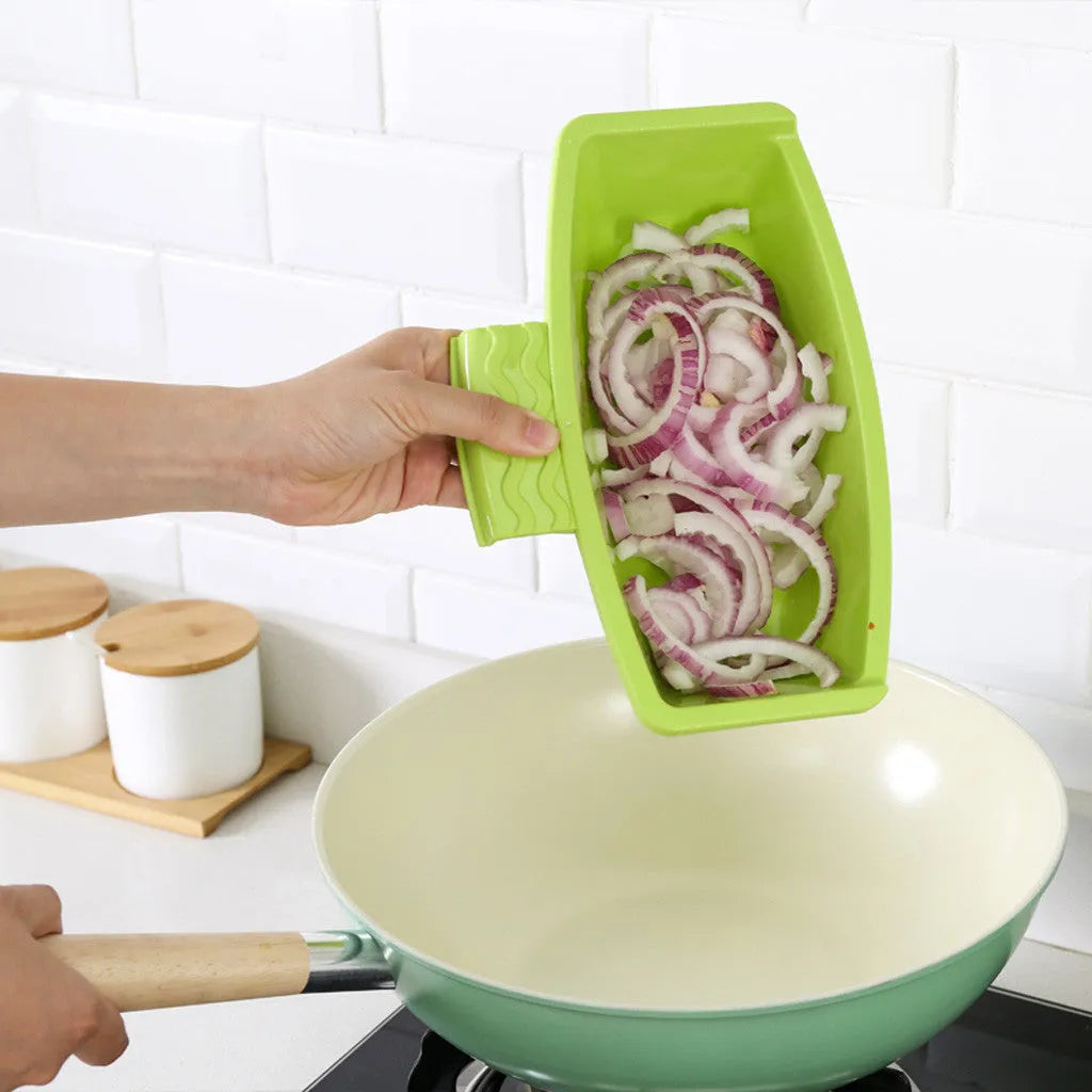 Green multifunction cutting board with drainage holes mounted on a kitchen sink edge.