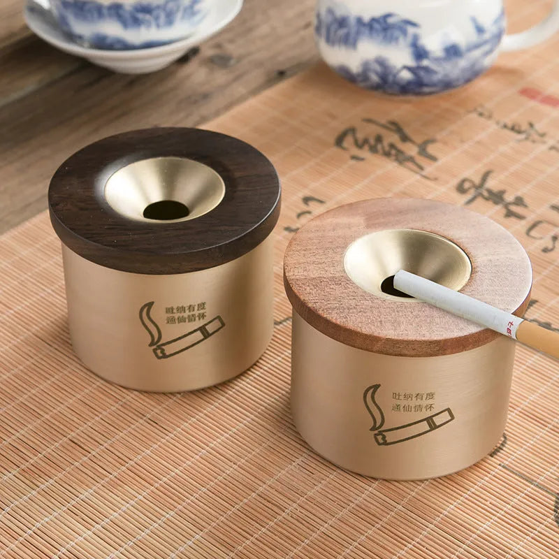 Retro brass ashtray with wooden lid showing centre hole design