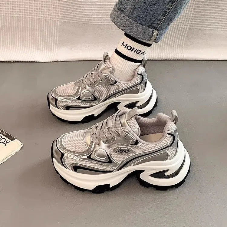 Women's silver mesh clunky platform sneakers with round toe and lace-up front.