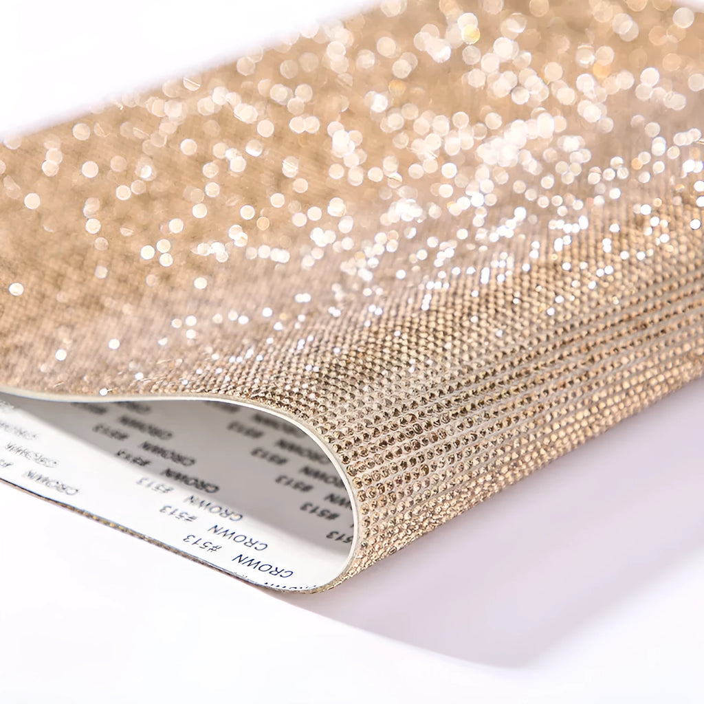 Sheet of rhinestones on adhesive net with hot drill glue backing in assorted colours.