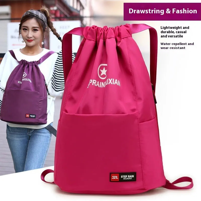 Solid colour drawstring backpack made of Oxford cloth with double shoulder straps.