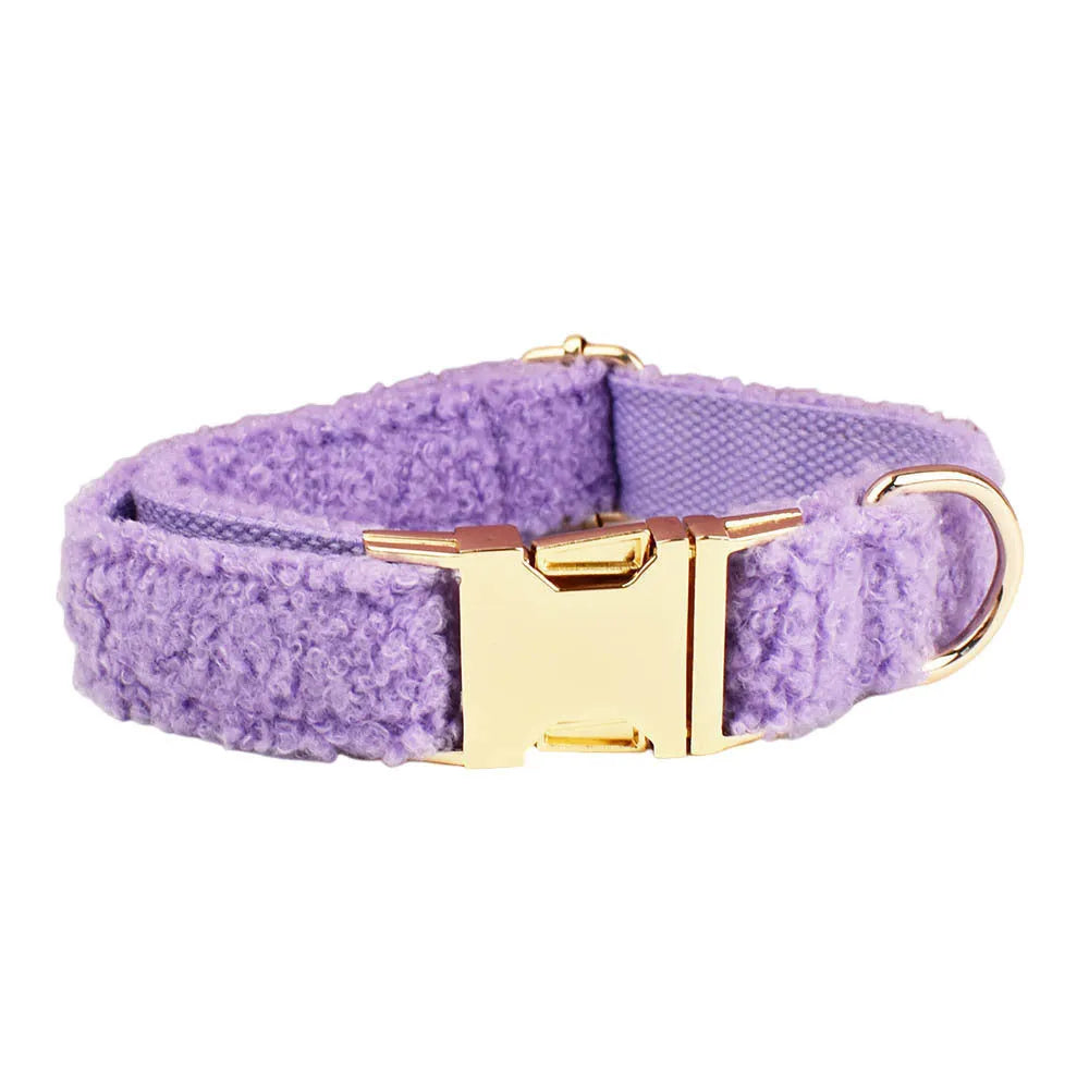 Purple cloth dog collar, lead, bow, and vest set laid out flat, showing the four matching accessories.