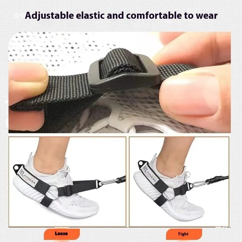 Black adjustable buckle ankle strength strap with foot lanyard for suspension training.