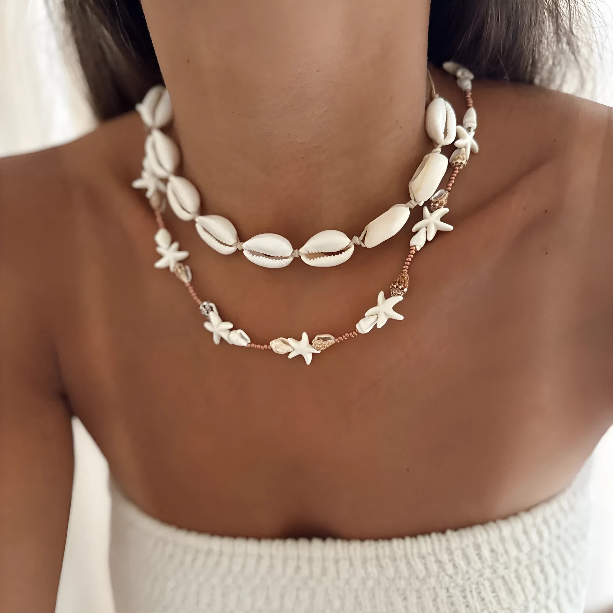 Handcrafted bohemian shell necklace with geometric pendant on a regular chain, colour X1900.