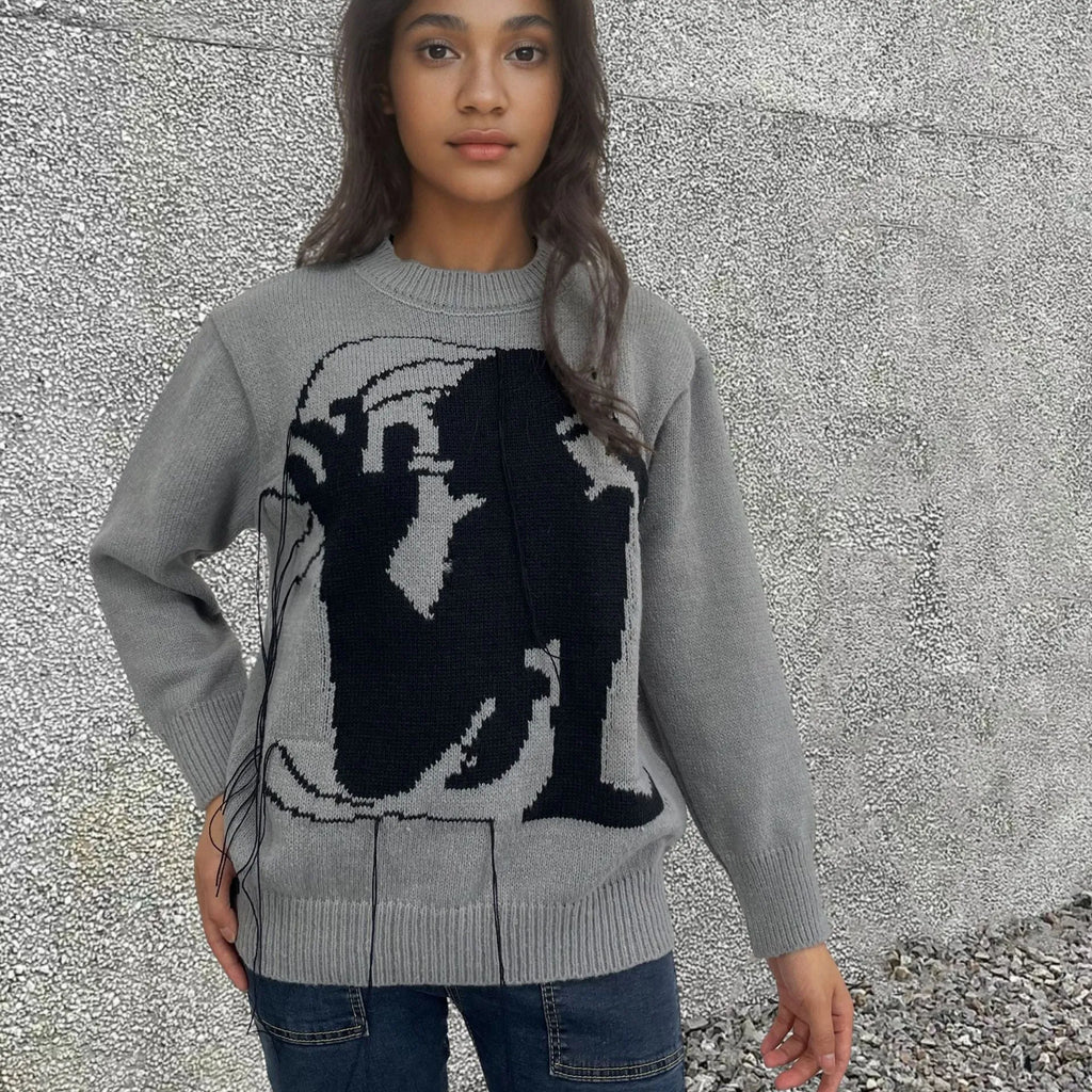 Women's loose grey alpaca wool pullover sweater with tassel detailing and round neck