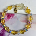 Natural citrine nine-tail fox crystal bracelet for women on a wrist.
