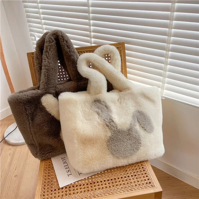 Plush shoulder bag with cartoon rabbit ears design in solid colour