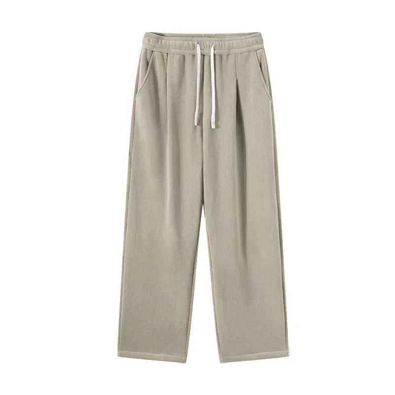Men's apricot coloured loose-fit polar fleece-lined casual winter trousers on a white background.