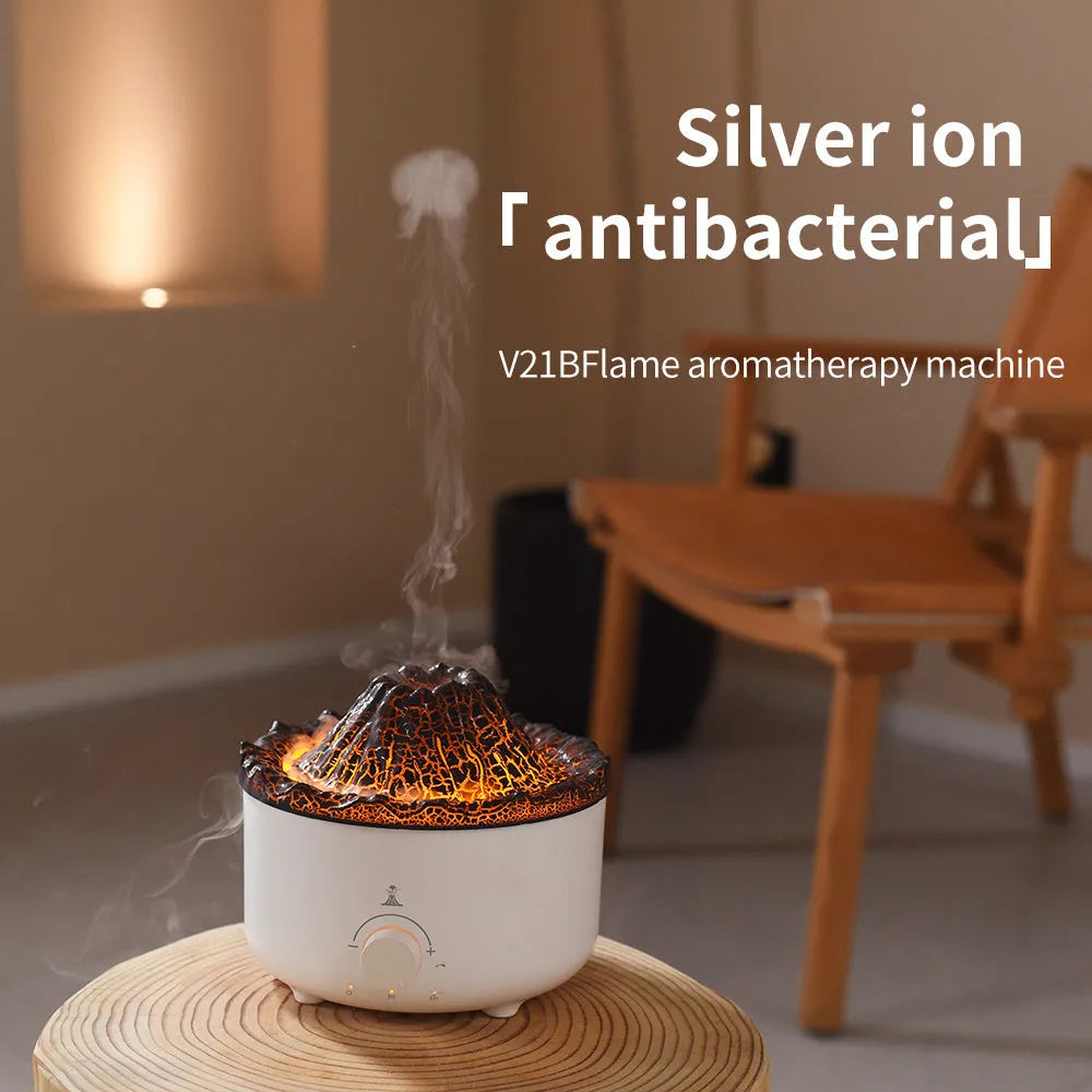 White simulated flame volcano humidifier diffuser with remote control on tabletop