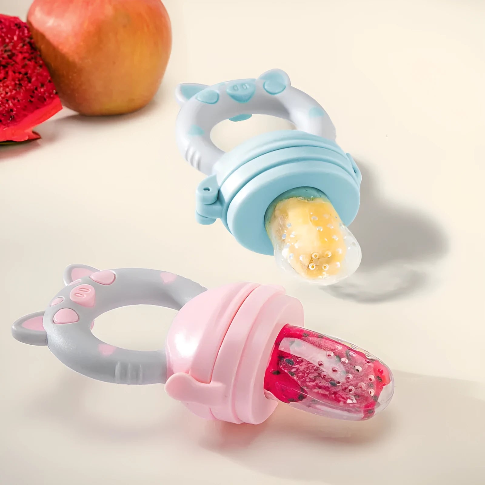Silicone baby teether shown in blue, green, and pink colours with single and triple mouthpiece options