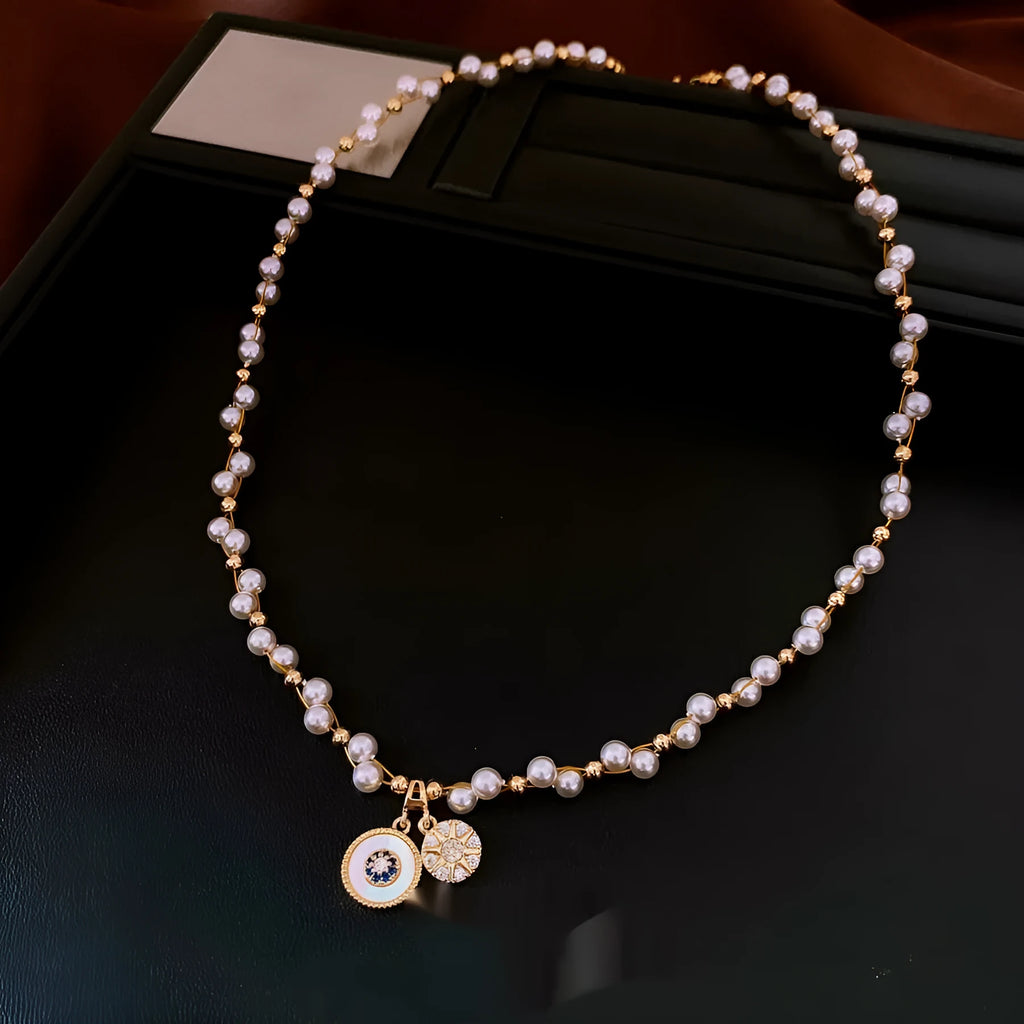 Gold electroplated necklace with round imitation pearl pendant and zircon accents on 41-50cm clavicle chain