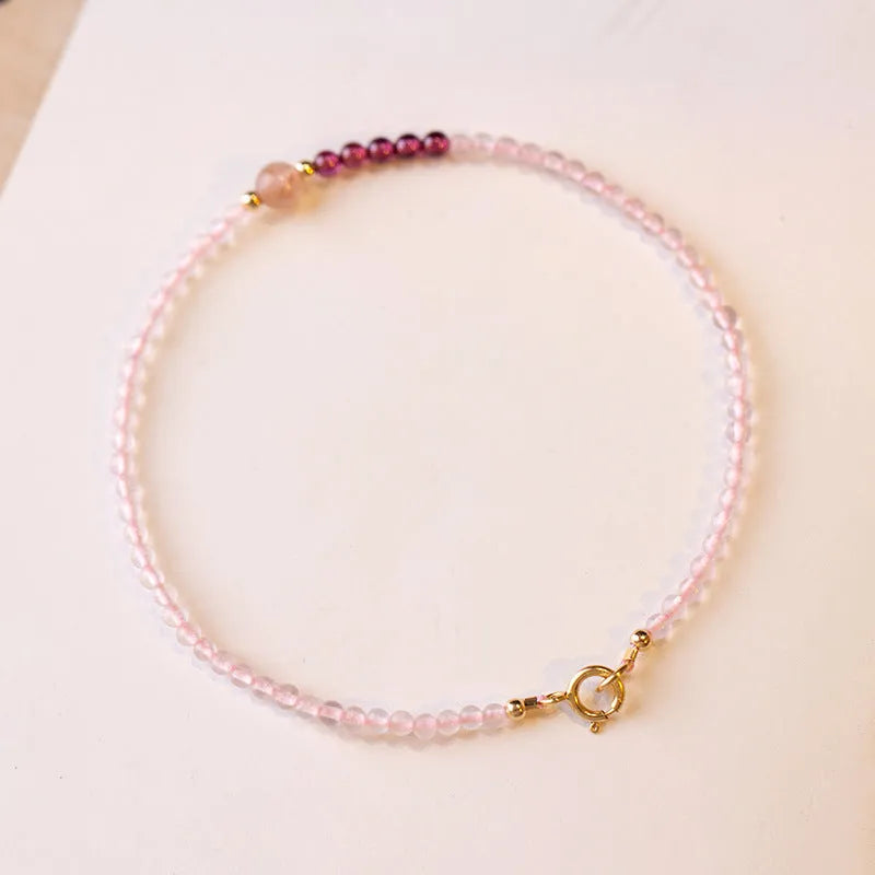 Handmade pink crystal bracelet with strawberry quartz beads and animal zodiac design