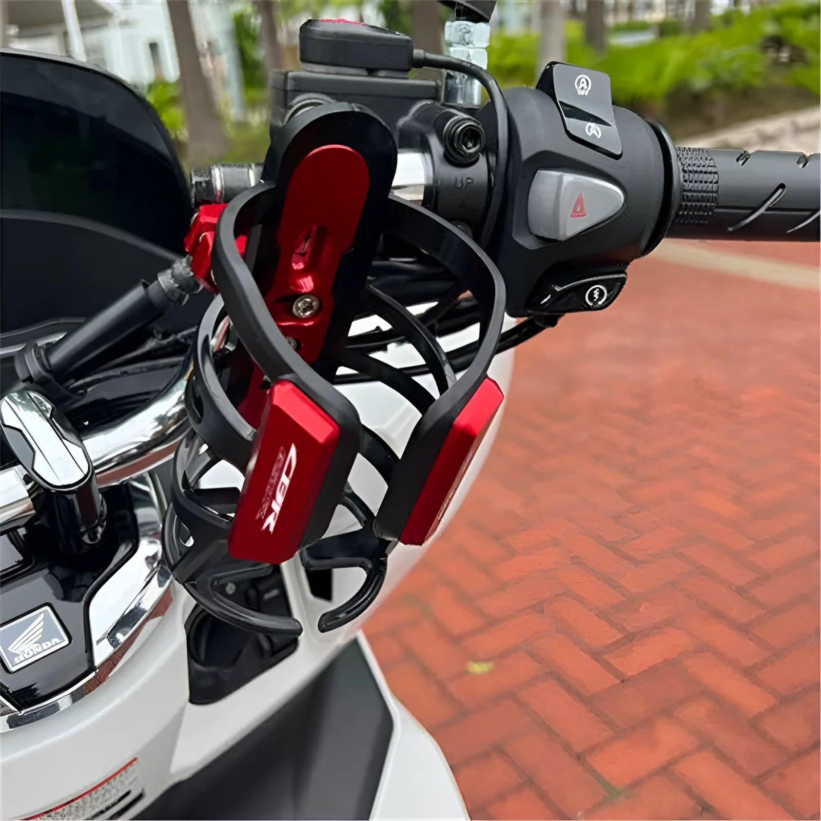Aluminium water bottle cage kit for Honda X-ADV scooter bumper modification.