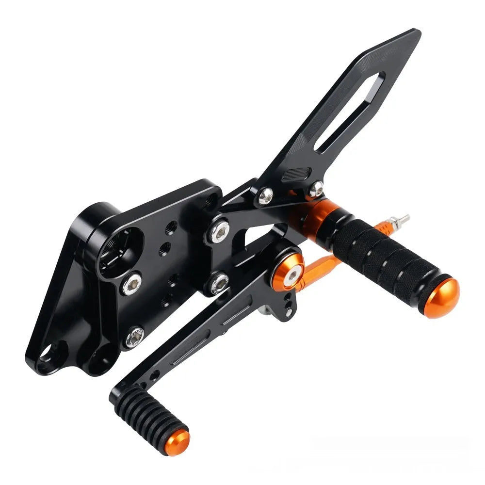 KTM Duke motorcycle pedal support assembly in black and orange for 125 200 250 390 models