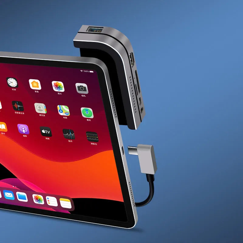 Silver aluminium grey Type-C 6-in-1 docking station for iPad Pro, showing multiple ports.