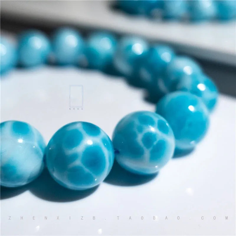 Blue bodhi bracelet with natural crystal sea-pattern stone centrepiece and pearl details in Maillard style